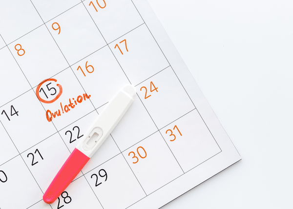 How can I use ovulation tracking to improve my chances of conceiving naturally?