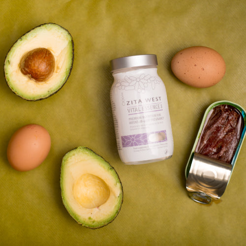Bottle of Zita West Vital Essence 3 supplement surrounded by avocado halves, eggs and a tin of fish