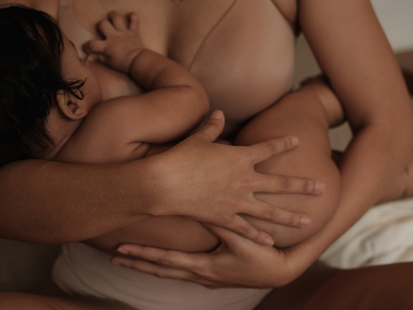 Close-up of a mother breastfeeding her baby