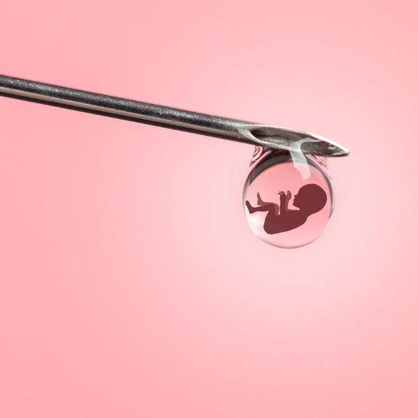 Illustration of an embryo inside a droplet balanced on the tip of a needle