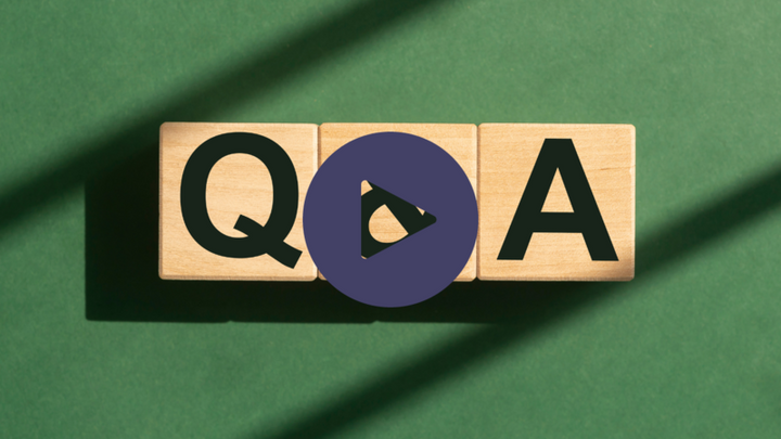Wooden letter blocks spelling Q and A on a green background with a purple play button overlay