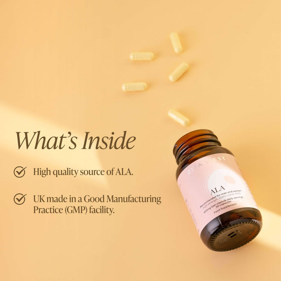 An open bottle of Zita West ALA on a yellow background with some capsules scattered