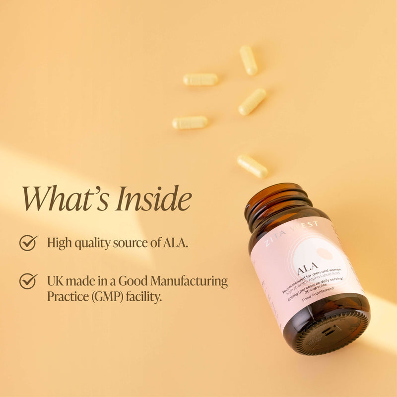 An open bottle of Zita West ALA on a yellow background with some capsules scattered