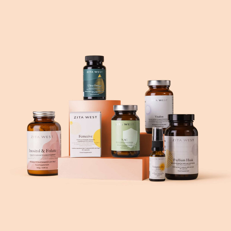A collection of supplement bottles and packaging labeled for PMOS support, arranged on a neutral background.