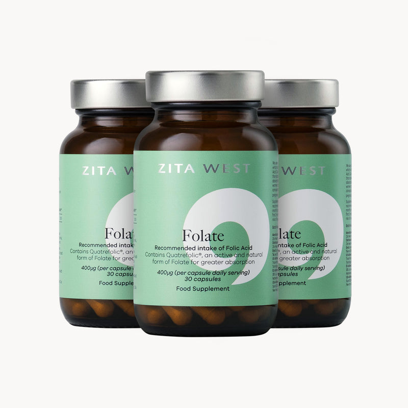 Three bottles of Zita West Folate supplement on a white background