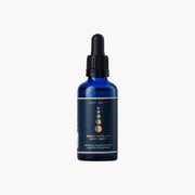 Blue bottle with dropper labeled 'Zita West' on a white background
