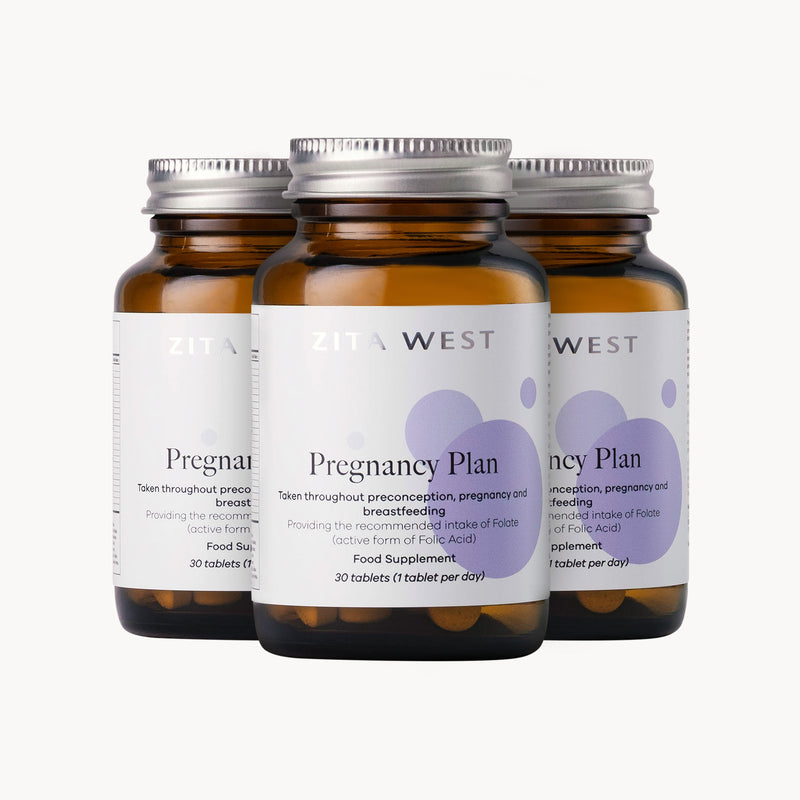 Three bottles of Zita West Pregnancy Plan supplement on a white background