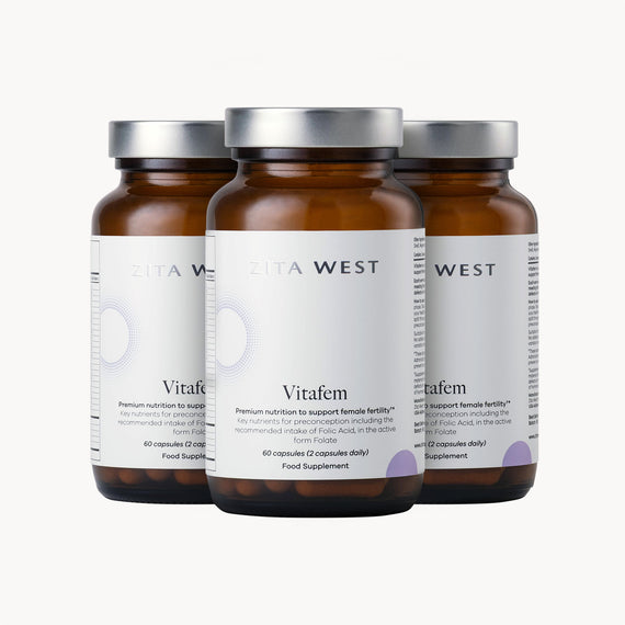 Three bottles of Vitafem on a white background