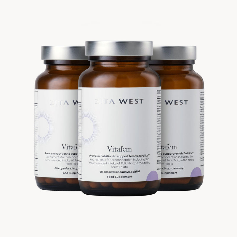 Three bottles of Vitafem on a white background