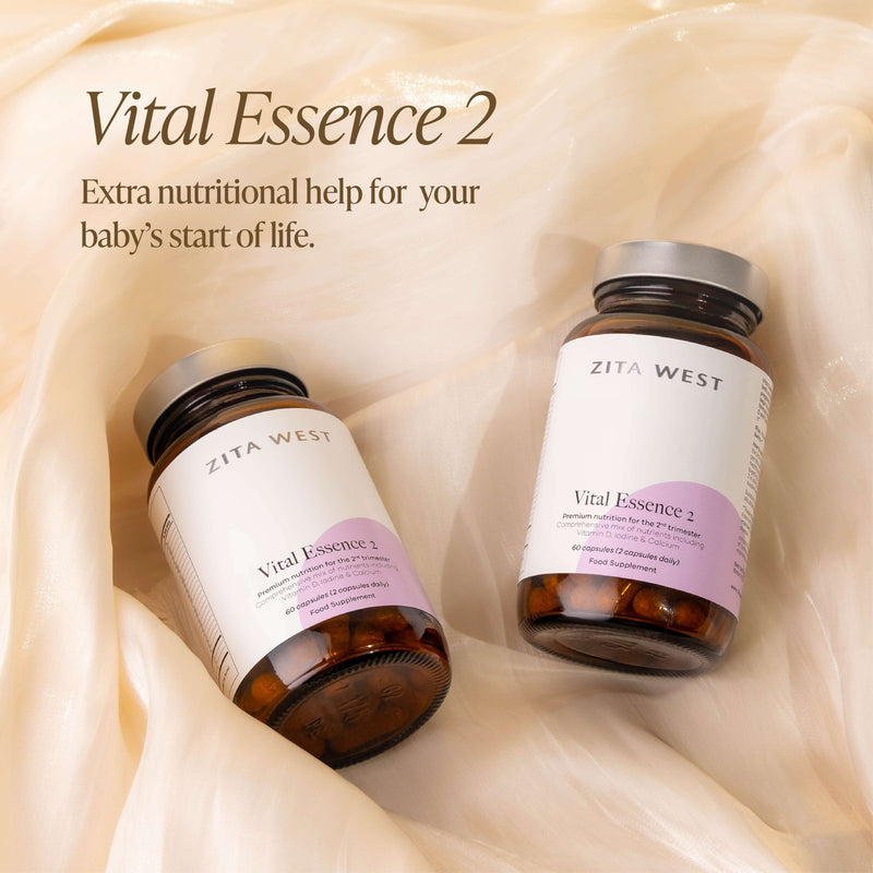 Two bottles of Vital Essence 2 on a beige background