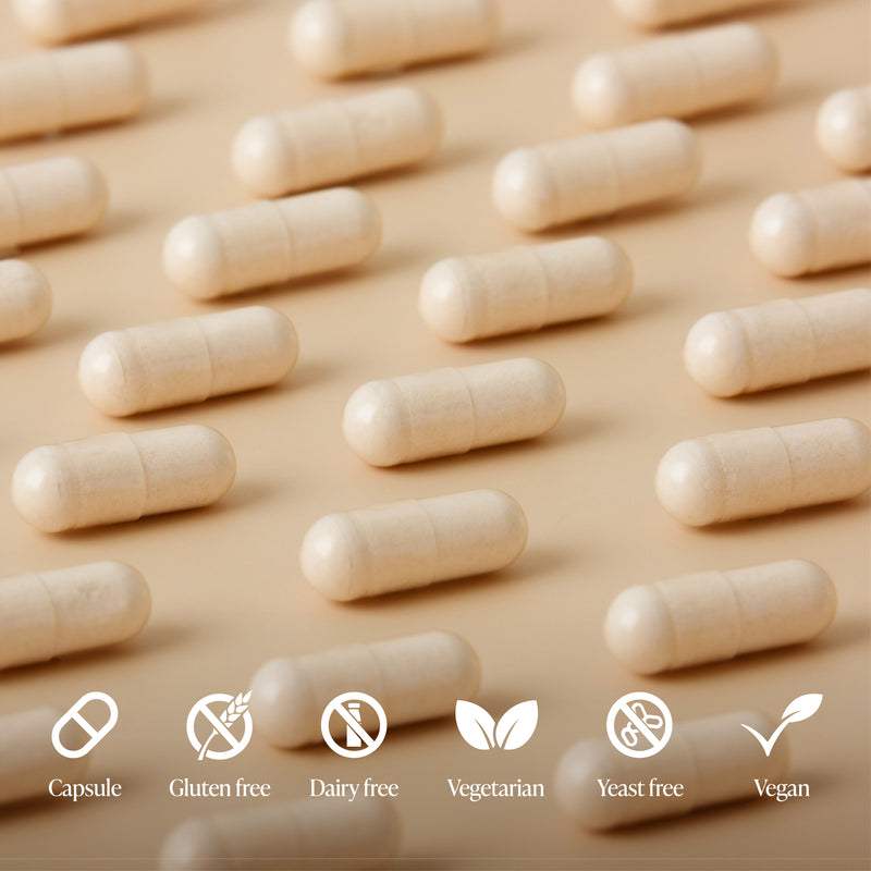 Row of beige capsules on a beige background with dietary freedom icons below.