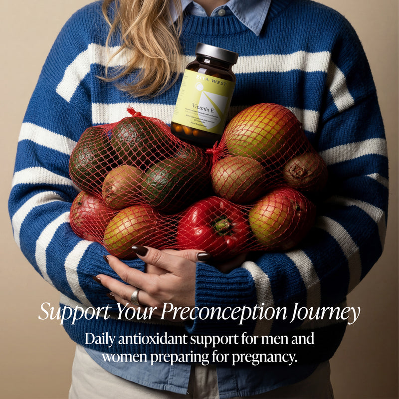 Person holding a bottle of supplements and a bag of fruits with text about preconception support.