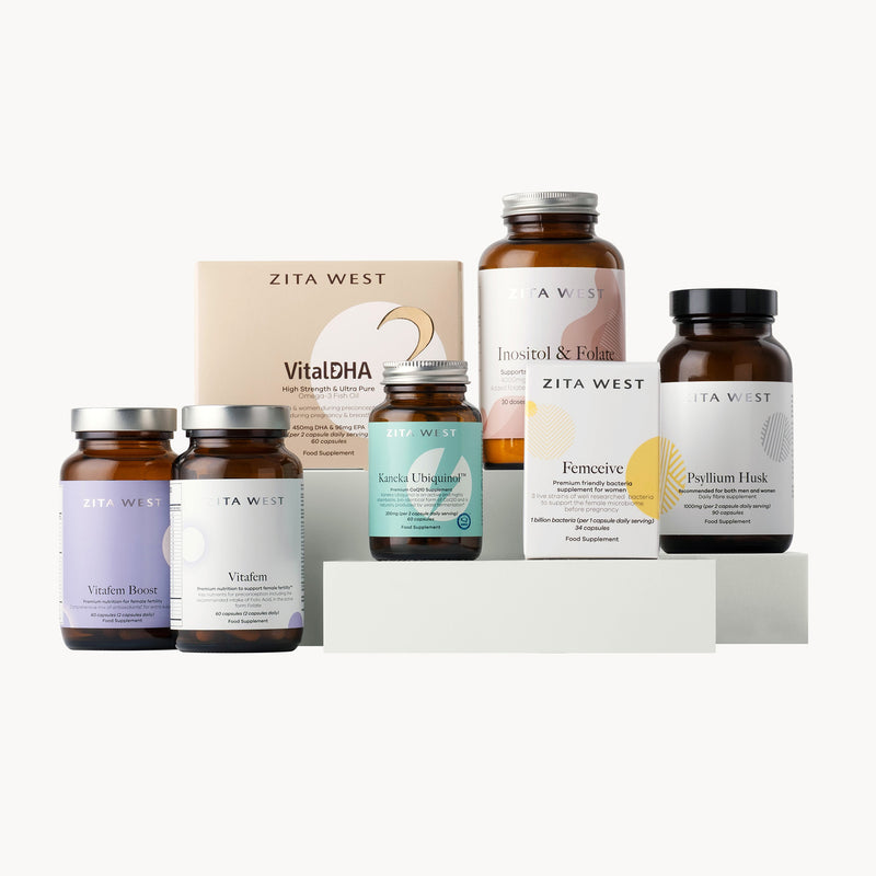 Collection of Zita West supplement bottles and boxes which support egg health on a white background
